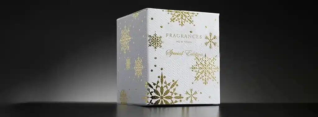 A white box Embellished With Shimmering Gold Snowflakes, Exemplifying The Refined Beauty Of Foil Stamping Printing