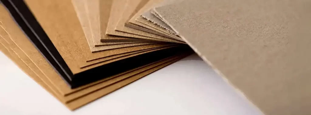 A Collection Of Brown Cardboard Sheets Arranged On A White Background, Highlighting Their Natural Hue and material