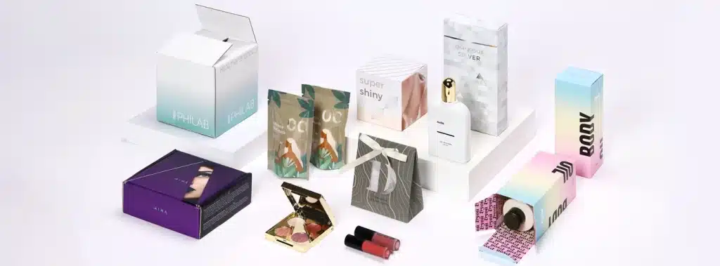 Various types of cosmetics packaging boxes arranged on a white surface, highlighting different materials and styles